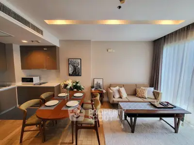 Modern open-plan living and dining area with stylish decor and natural light