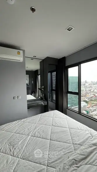 Modern bedroom with city view and sleek design