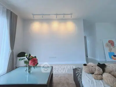 Spacious living room with modern decor and natural light