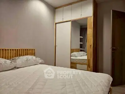 Modern bedroom with stylish wooden accents and built-in wardrobe