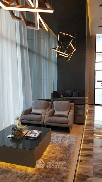 Luxurious modern living room with high ceilings and stylish lighting fixtures.