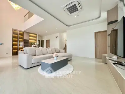 Spacious modern living room with elegant decor and cozy seating area