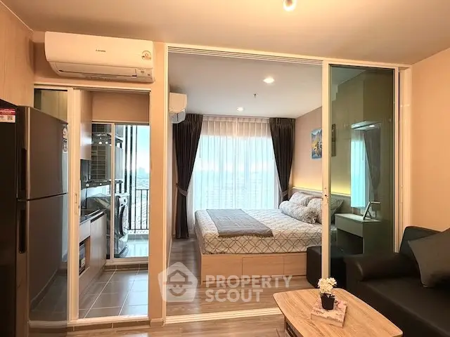 Modern apartment interior with cozy bedroom and open living area, featuring stylish decor and ample natural light.