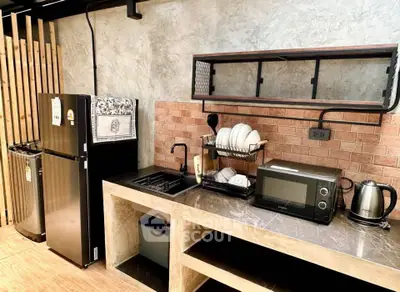 Modern kitchen with sleek appliances and stylish open shelving