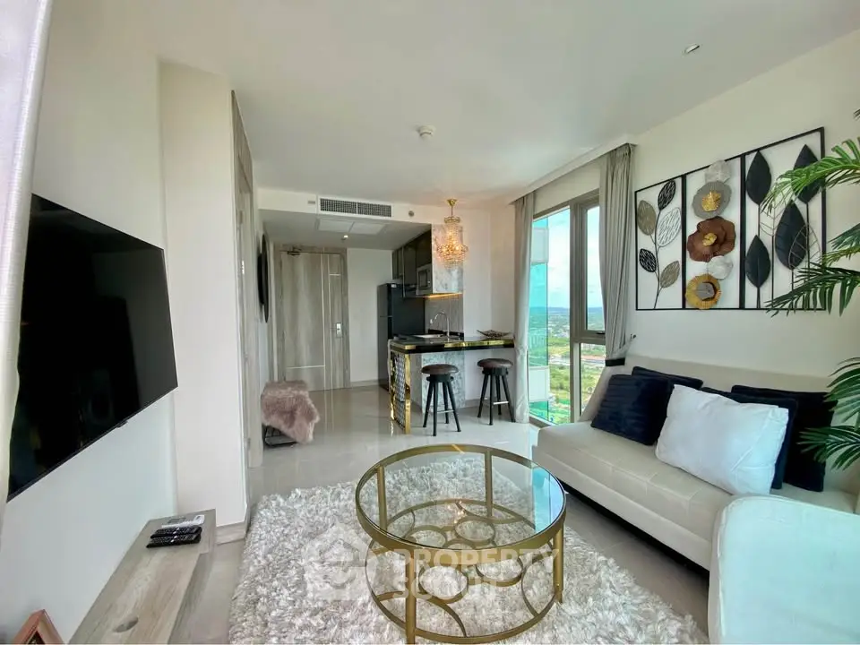 Luxurious modern living room with open kitchen and stunning view