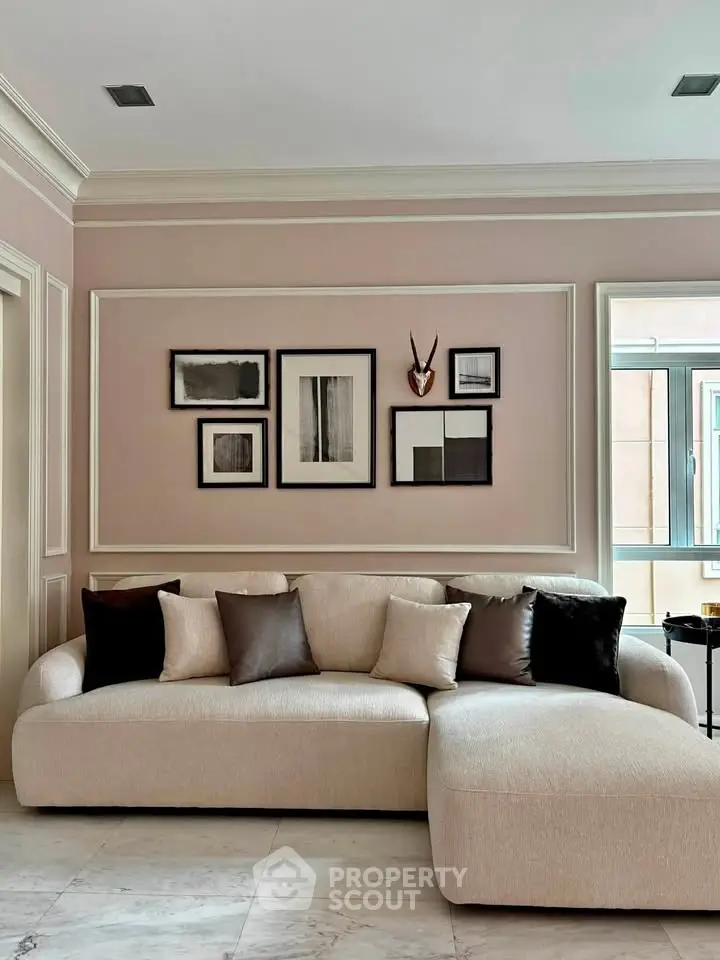 Elegant living room with stylish sofa and modern wall art, perfect for contemporary living.