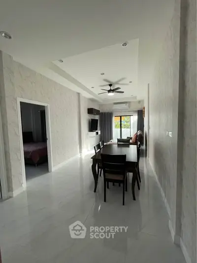 Spacious modern living room with dining area and natural light