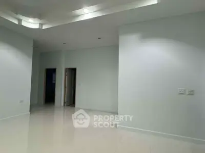 Spacious modern interior with high ceilings and minimalist design, perfect for customization.