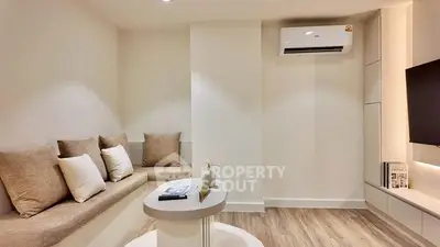 Modern living room with built-in seating and air conditioning
