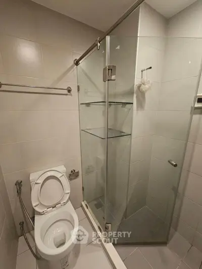 Modern bathroom with glass shower and sleek toilet design