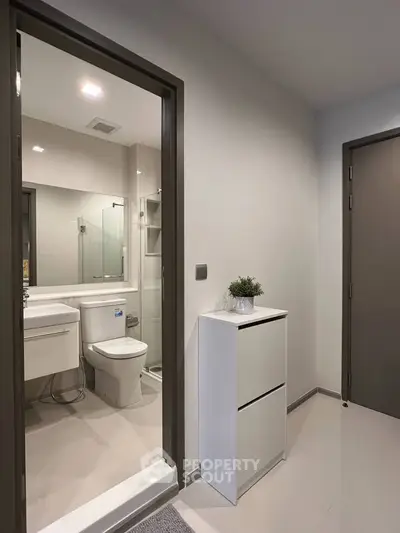 Modern bathroom with sleek fixtures and minimalist design in a contemporary apartment.