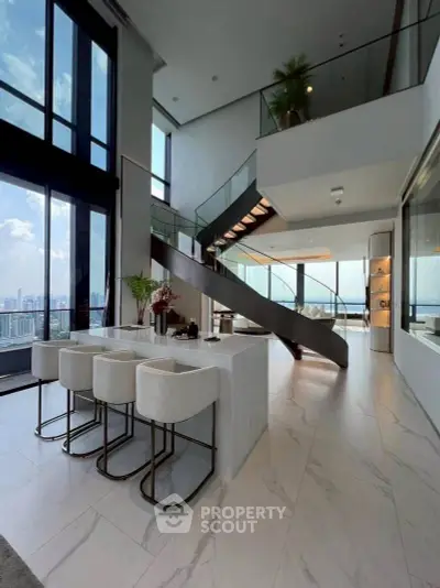 Luxurious modern living room with stunning city view and elegant staircase