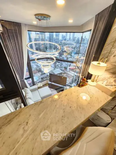 Luxurious high-rise living room with stunning city view and modern chandelier