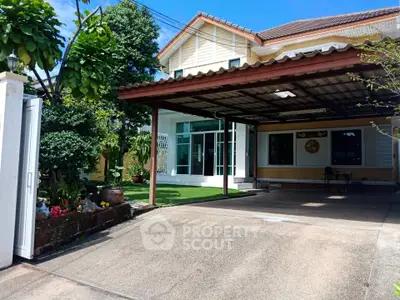 Charming suburban home with spacious driveway and lush garden, perfect for family living.