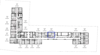 Detailed floor plan layout showcasing apartment units with measurements and room configurations.