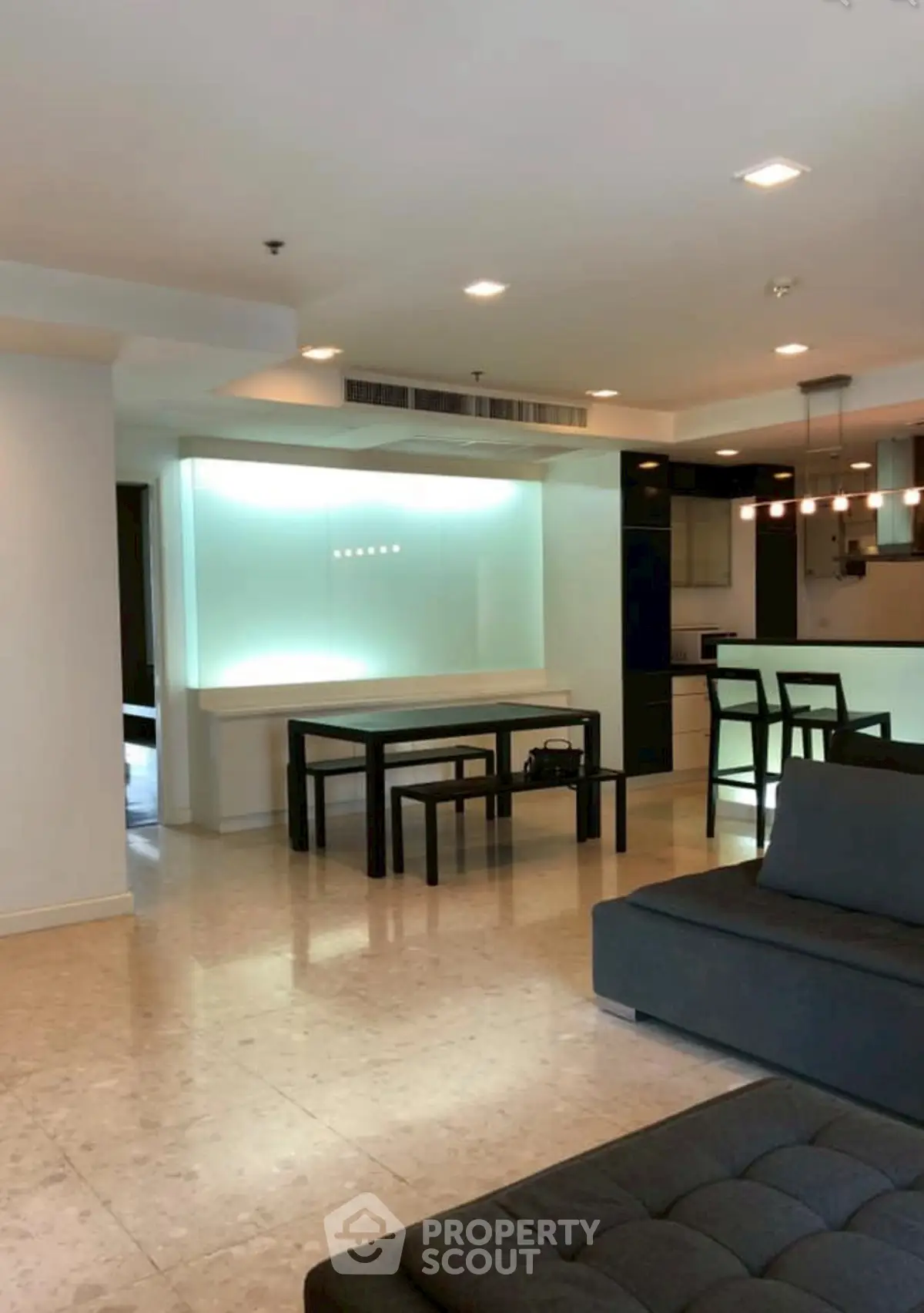 Spacious modern living room with open kitchen and stylish furniture