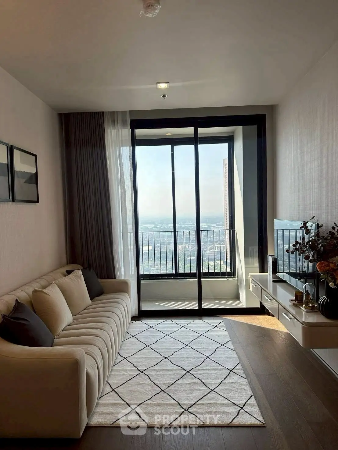 Modern living room with balcony and stunning city view