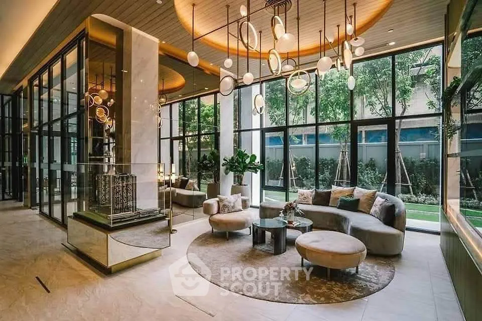 Luxurious modern living room with elegant lighting and large windows overlooking a garden.