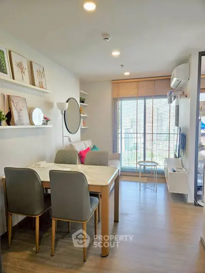 Modern living room with dining area and balcony view in stylish apartment