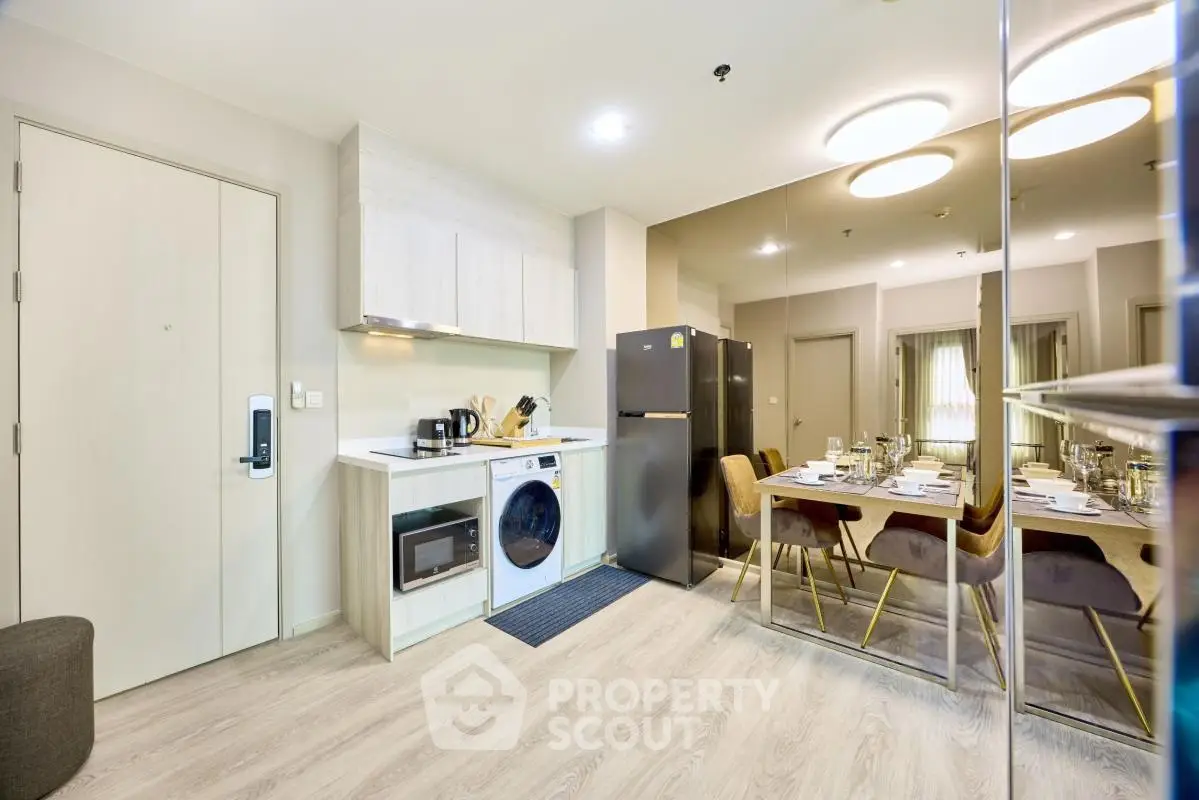 Modern kitchen and dining area with sleek appliances and stylish decor
