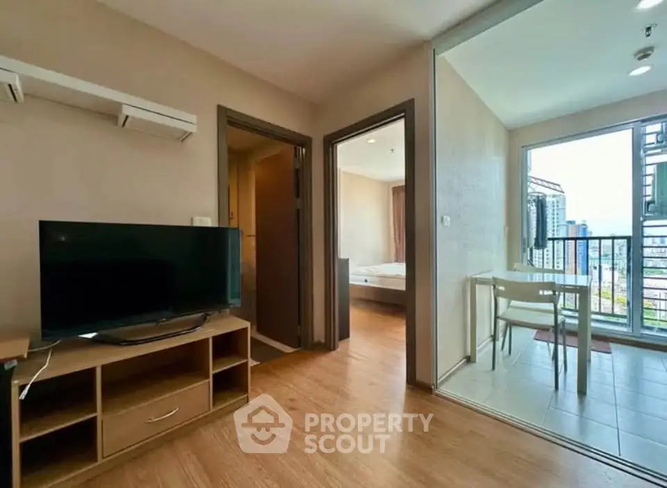 Modern apartment interior with living room, bedroom, and balcony view.