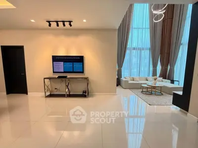 Luxurious modern living room with high ceilings and elegant decor