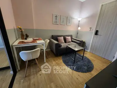 Chic modern living room with cozy sofa and stylish dining area, perfect for urban living.