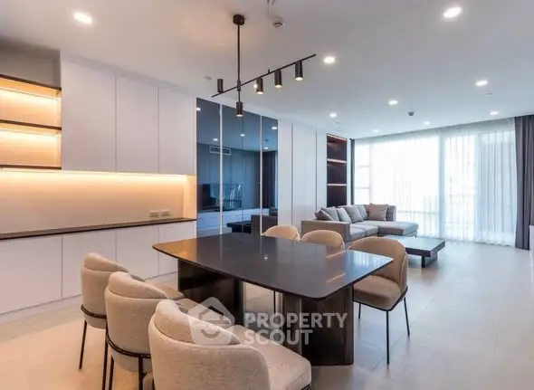 Spacious modern living room with elegant dining area and natural light