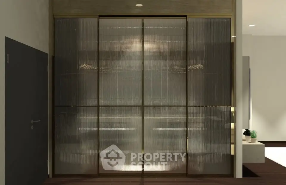 Elegant modern entrance with sleek glass doors and minimalist decor