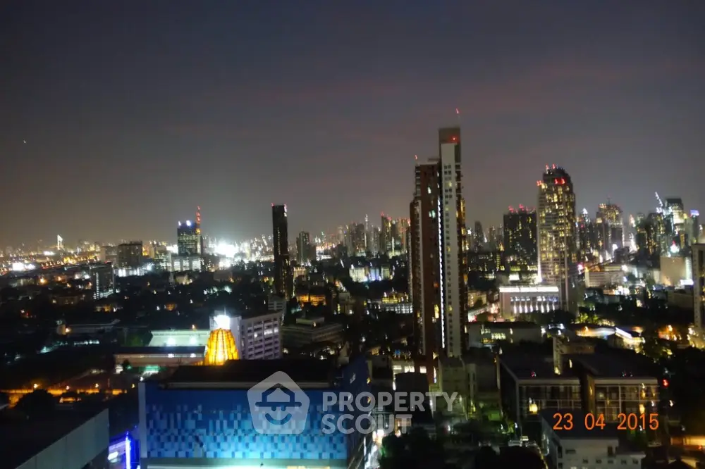 Stunning city skyline view at night with illuminated skyscrapers and vibrant urban landscape.