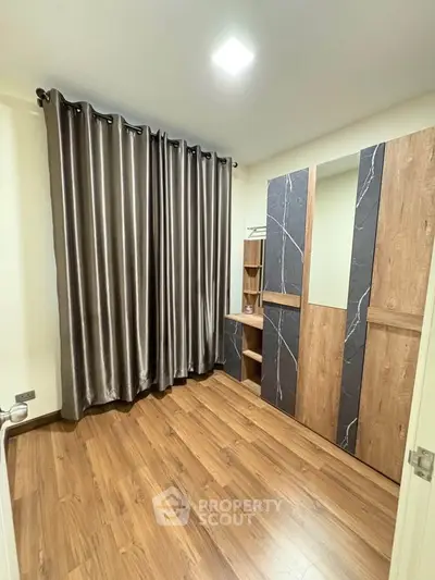 Modern bedroom with elegant curtains and stylish wardrobe