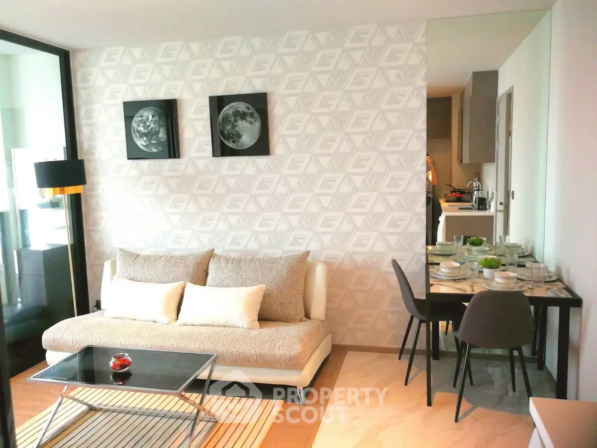 Modern living room with stylish decor and dining area in open layout apartment.