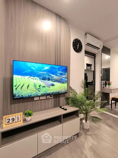 Modern living room with wall-mounted TV and stylish decor
