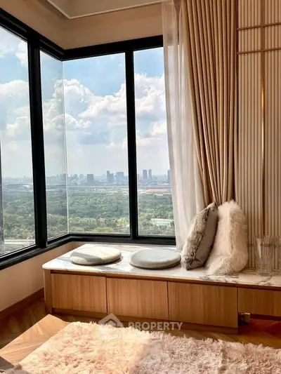 Luxurious corner unit with stunning city view and cozy seating area.