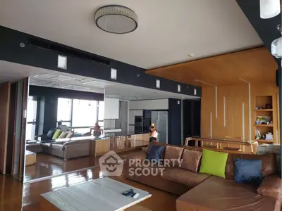 Spacious modern living room with open kitchen and stylish decor
