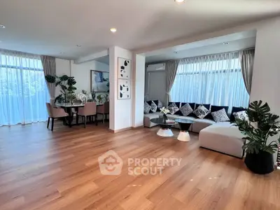 Spacious modern living room with elegant dining area and stylish decor
