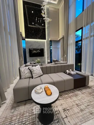 Luxurious modern living room with high ceilings and elegant decor