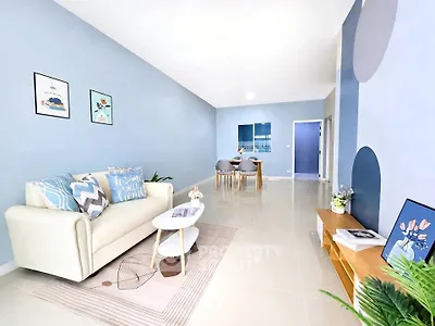 Spacious modern living room with stylish decor and open dining area