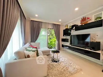 Elegant living room with modern decor and large windows for natural light