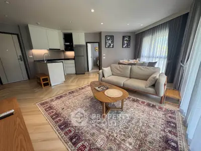 Spacious modern living room with open kitchen and elegant decor
