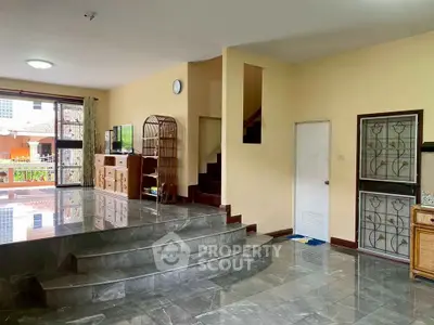 Spacious living room with marble flooring and modern decor