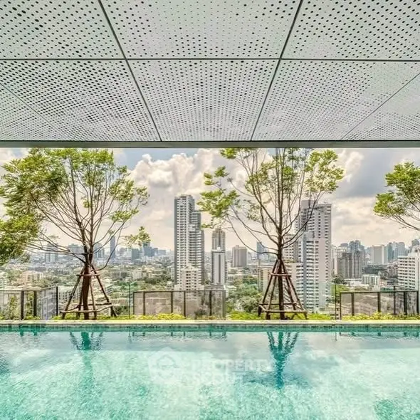 Luxurious rooftop pool with stunning city skyline views and lush greenery.