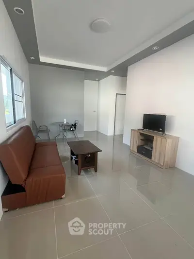 Modern living room with sleek furniture and neutral tones