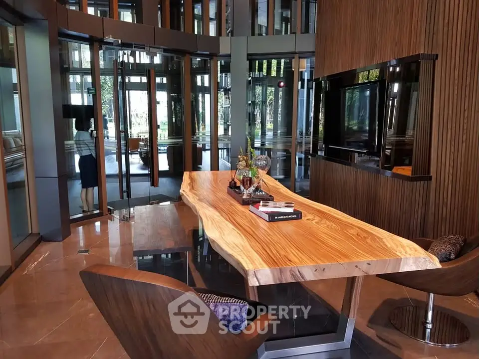 Luxurious modern study with elegant wooden table and sleek design elements.