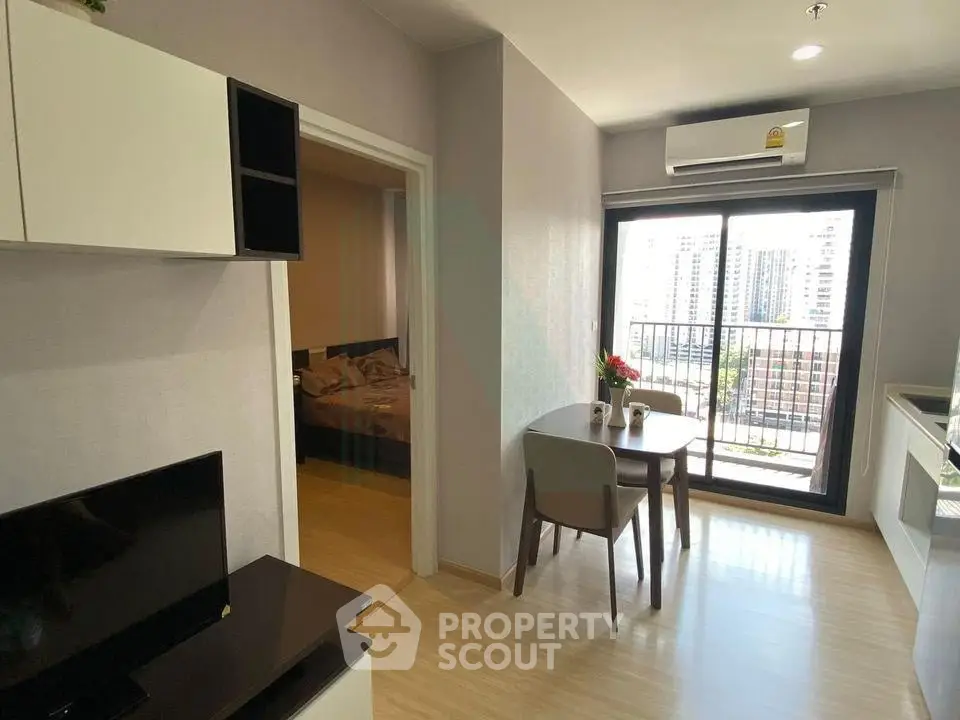 Modern apartment with open living area and balcony view
