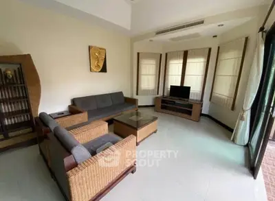 Spacious living room with modern furniture and natural light