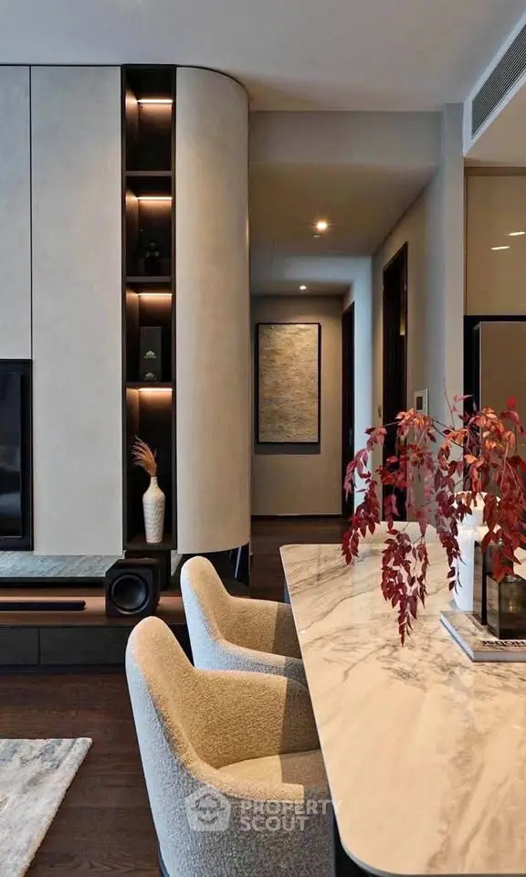 Luxurious modern living room with elegant marble table and plush chairs