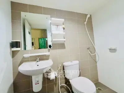Modern bathroom with sleek fixtures and neutral tile design