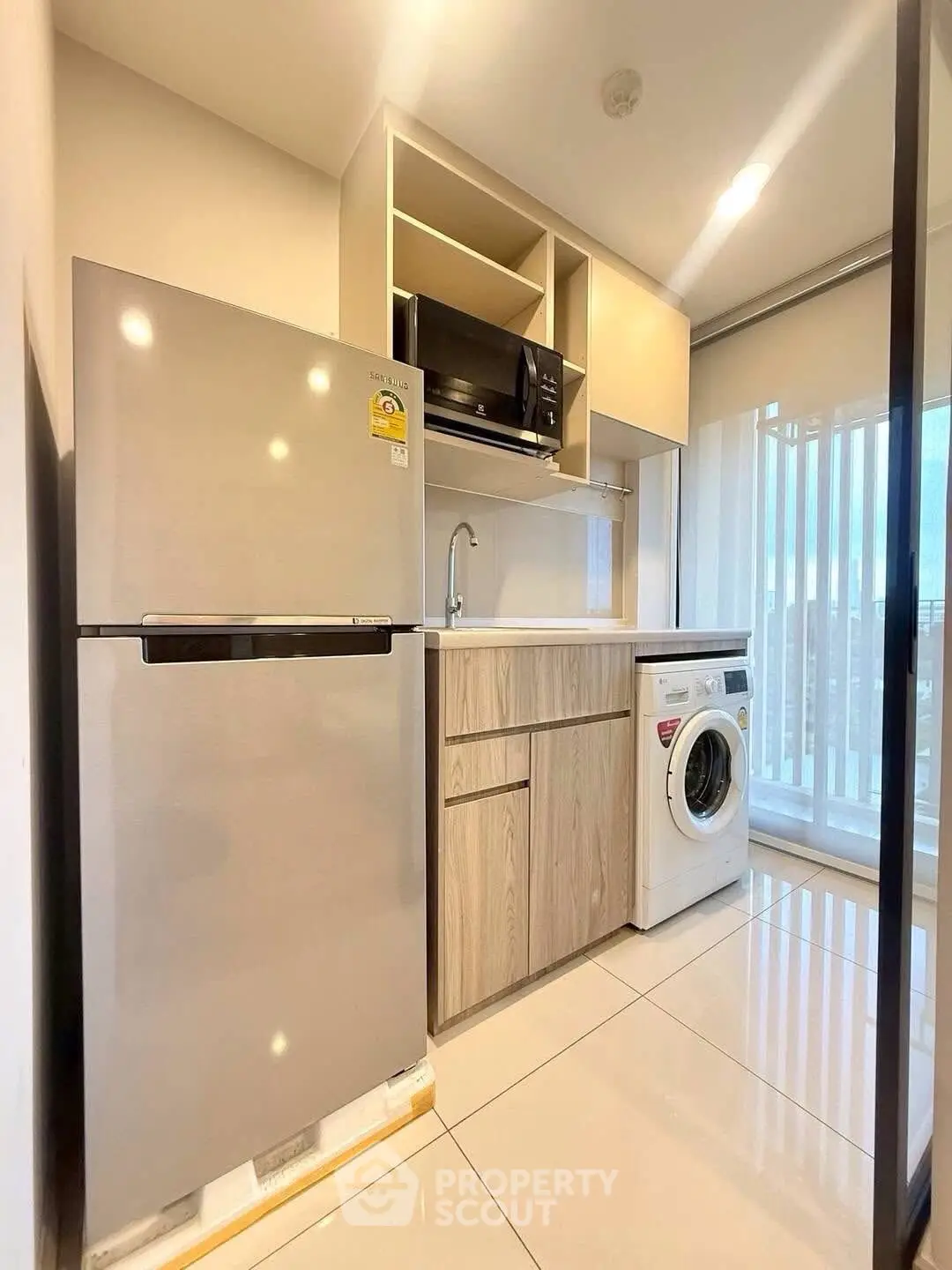 Modern kitchen with sleek appliances and ample storage space