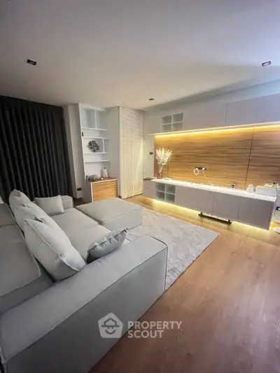 Modern living room with sleek design and ambient lighting